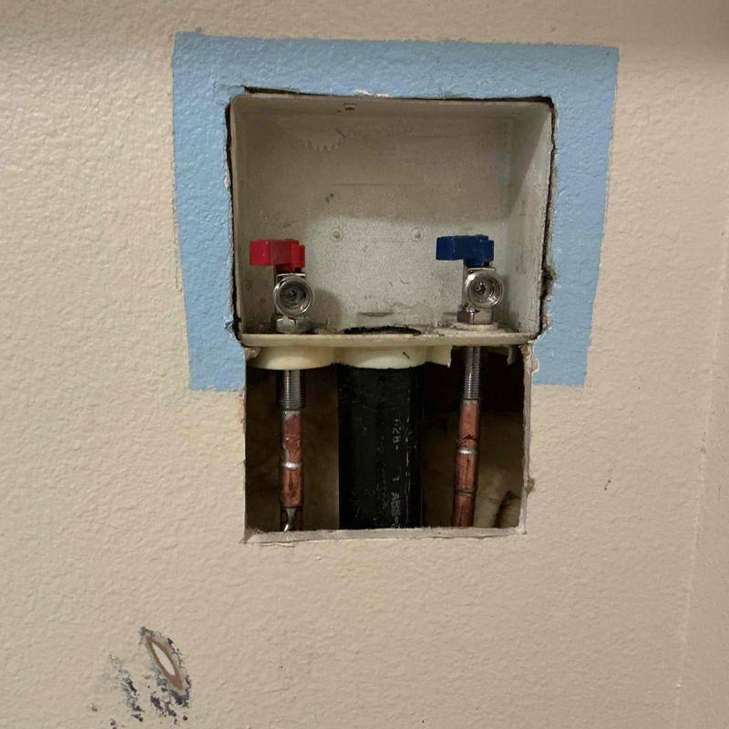 Washer valves and water lines in drywall cutout