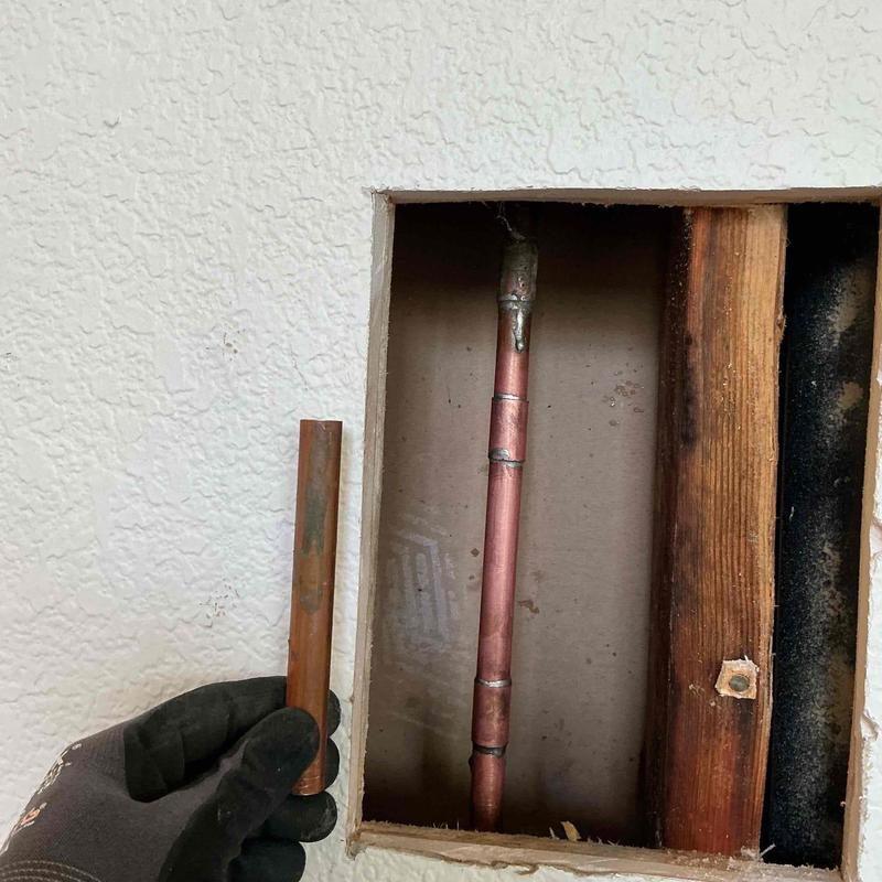 Copper pipe repair in living room wall cavity