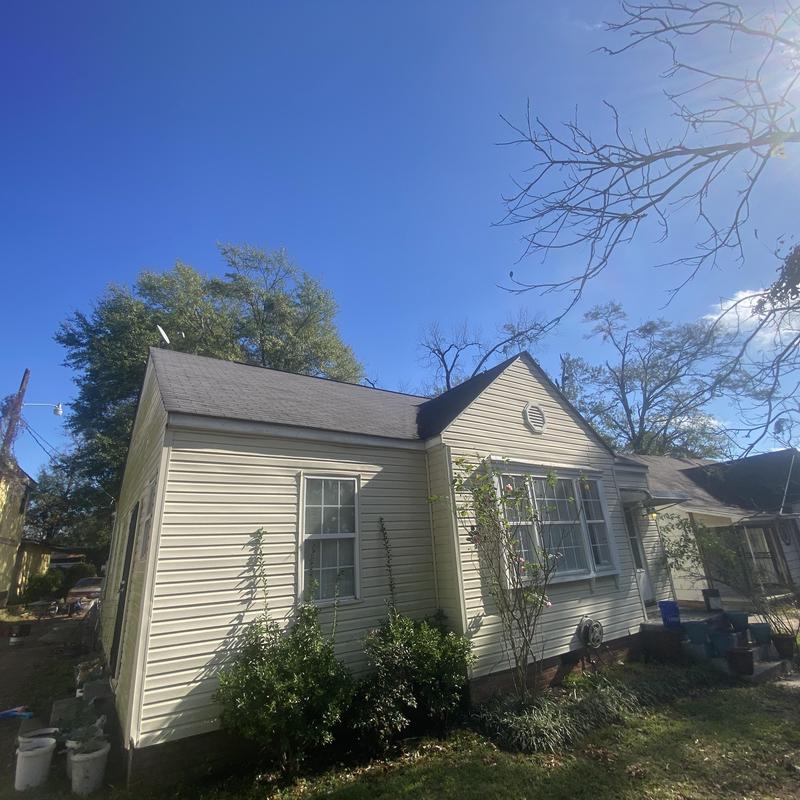 Composite shingle roof and siding on residential home Composite shingle roof and siding on residential home