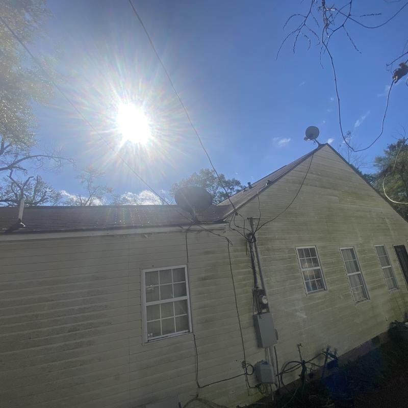 Composite shingle roof with satellite dishes on house Composite shingle roof with satellite dishes on house