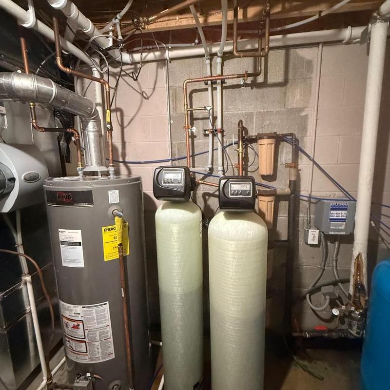 Iron filter and water softener tanks with controls