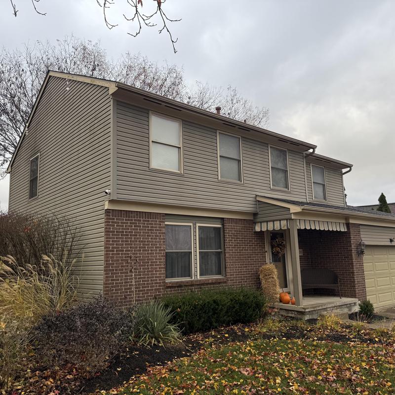 Vinyl siding and soffit inspection on two-story house