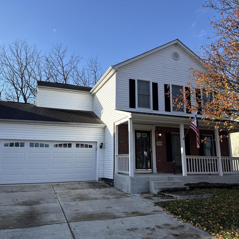 Asphalt shingle roof on two-story house exterior Asphalt shingle roof on two-story house exterior