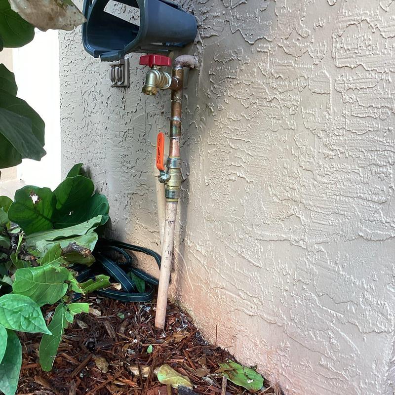 Quarter-turn hose bib valve and piping outside wall