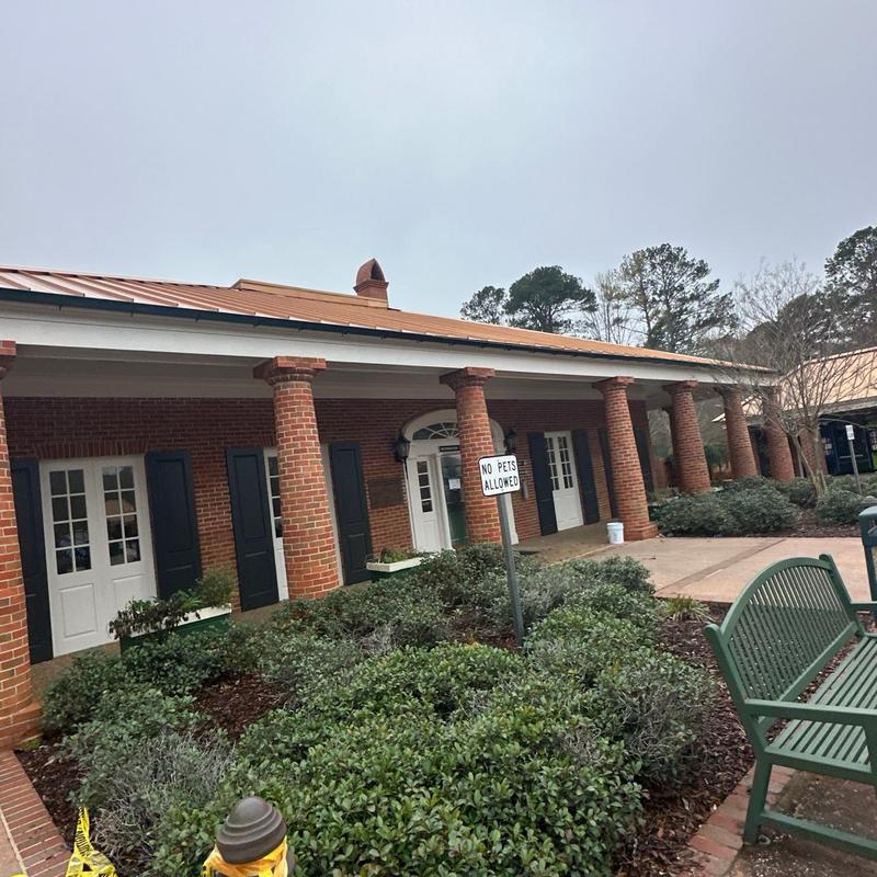 Metal roof on brick rest area with columns Metal roof on brick rest area with columns