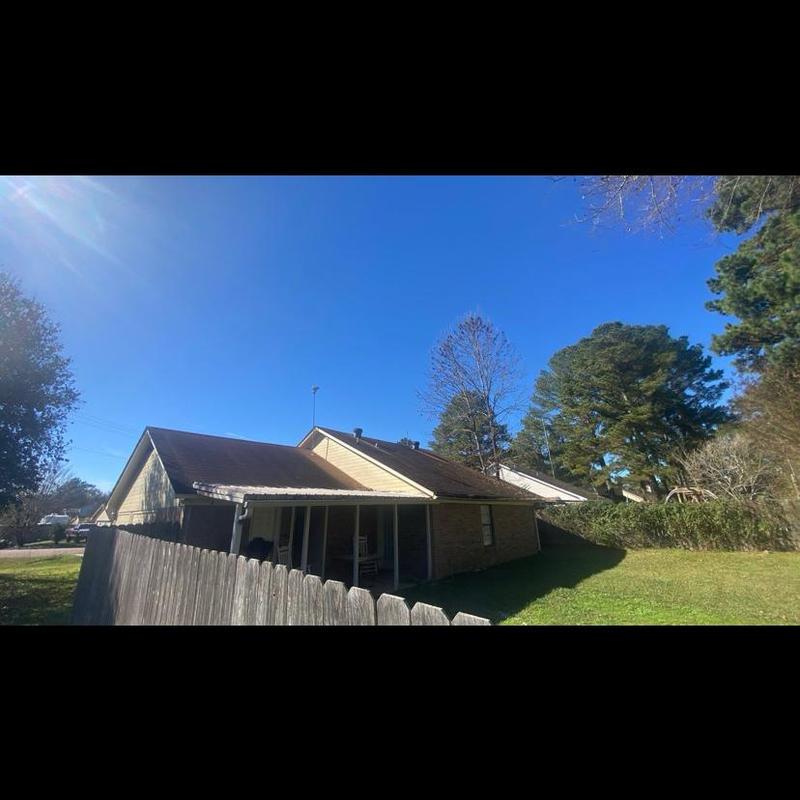 Shingle roofing on house and attached garage slopes Shingle roofing on house and attached garage slopes