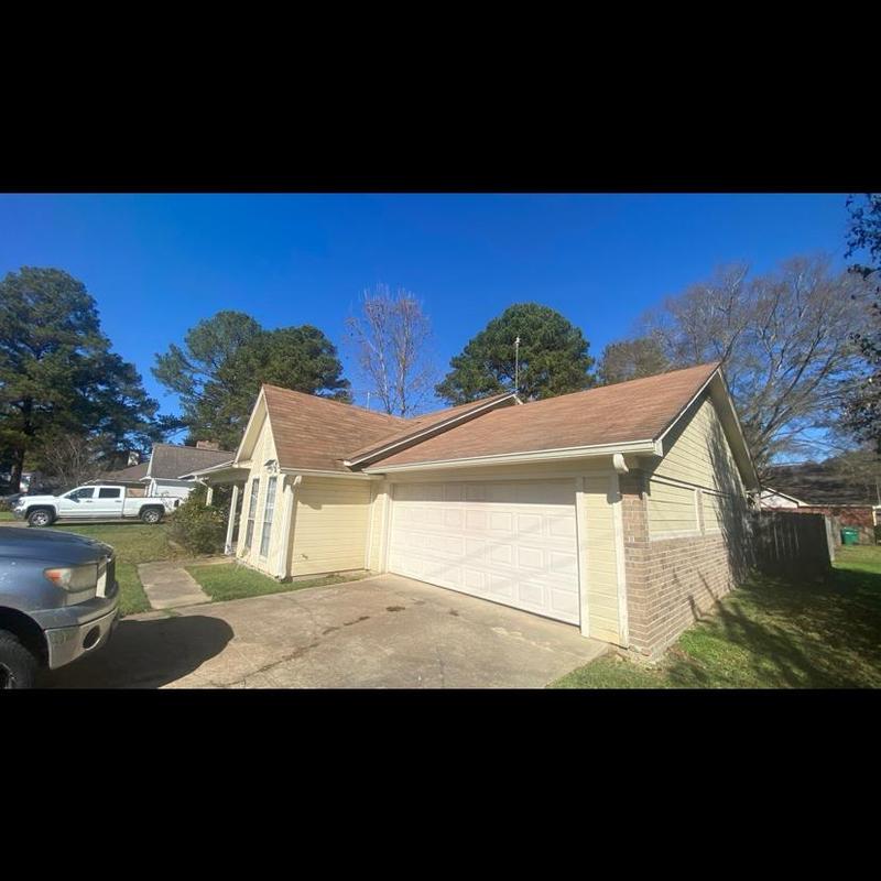 Shingle roofing on house and attached garage Shingle roofing on house and attached garage