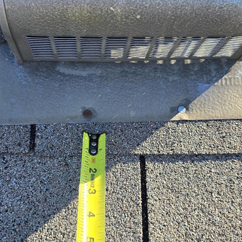 Roof vent measurement with tape on shingle roof