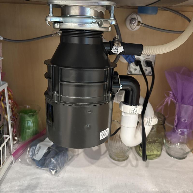 Garbage disposal installed under kitchen sink