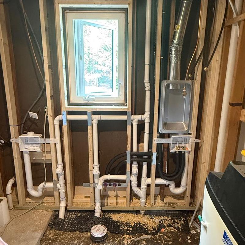 Laundry room PVC water piping and vent system installation