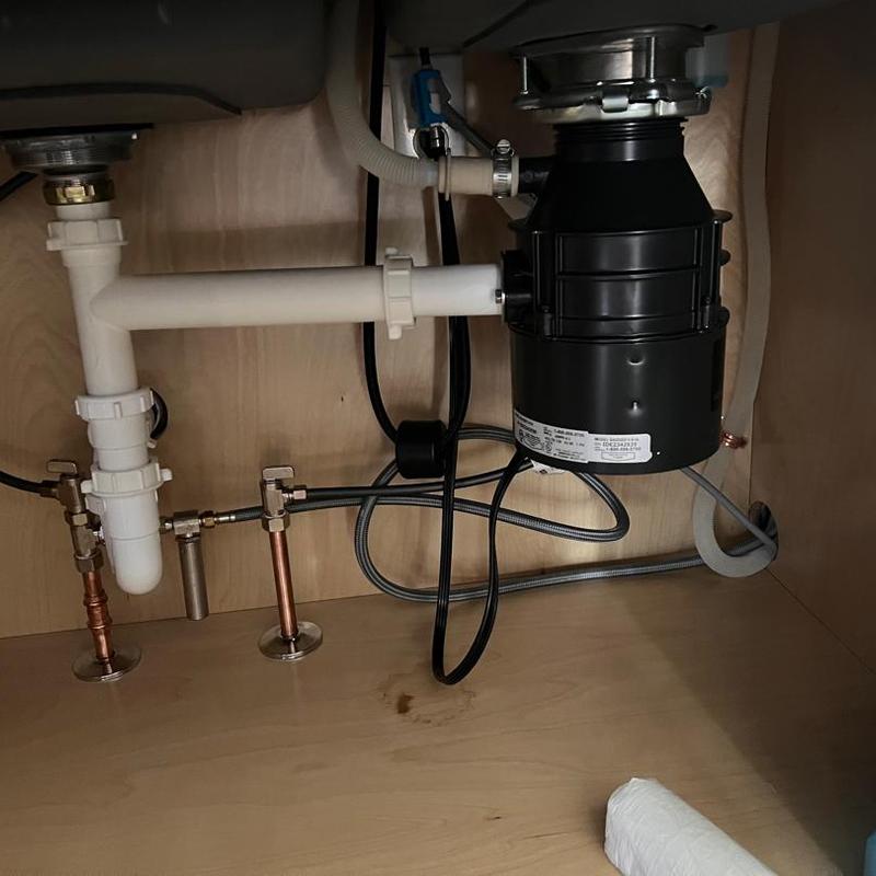 Garbage disposal installed under kitchen sink