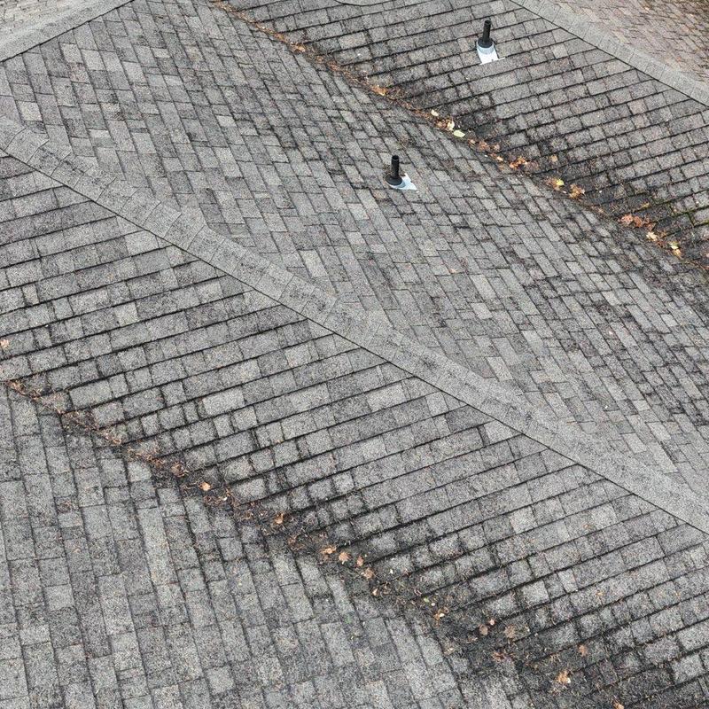 Asphalt roof shingles with ventilation pipe flashing