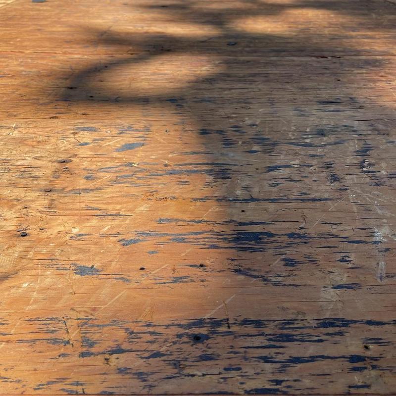 Plywood roof decking with dry rot damage close-up