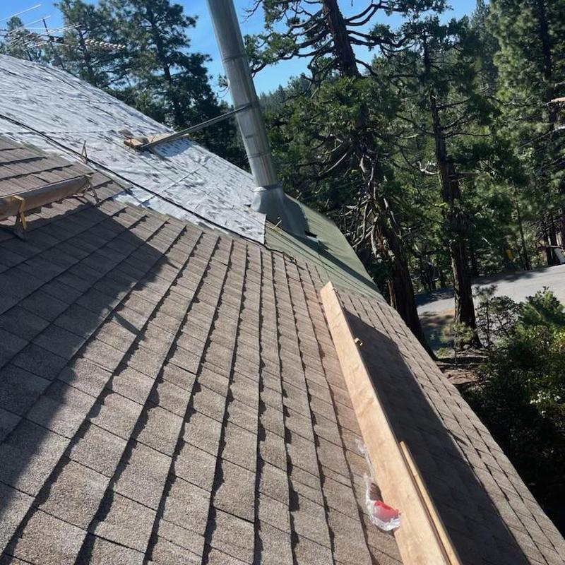 GAF asphalt shingle roof installation with chimney flashing