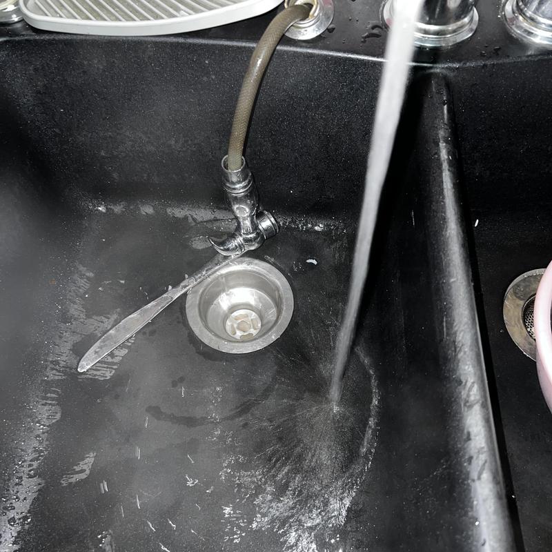 Kitchen sink drain with running water after unclogging