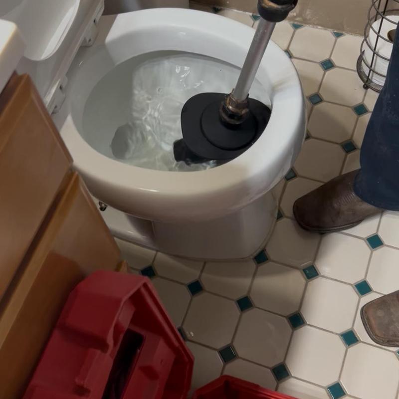 Toilet blockage clearing with air snake tool