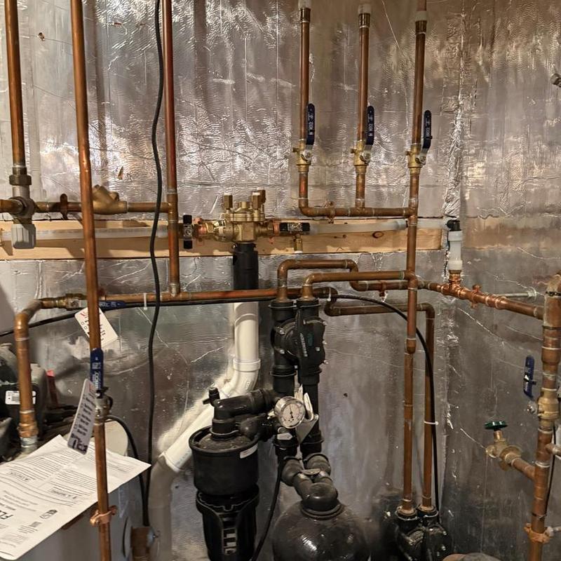 City water powered backup sump pump system with RPZ