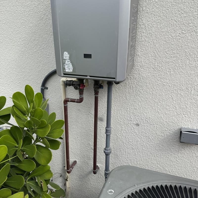 Tankless water heater with piping and outdoor unit