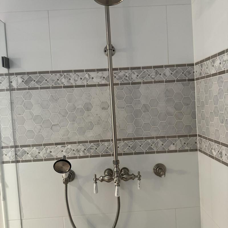 Shower valve and handheld holder installation in bathroom