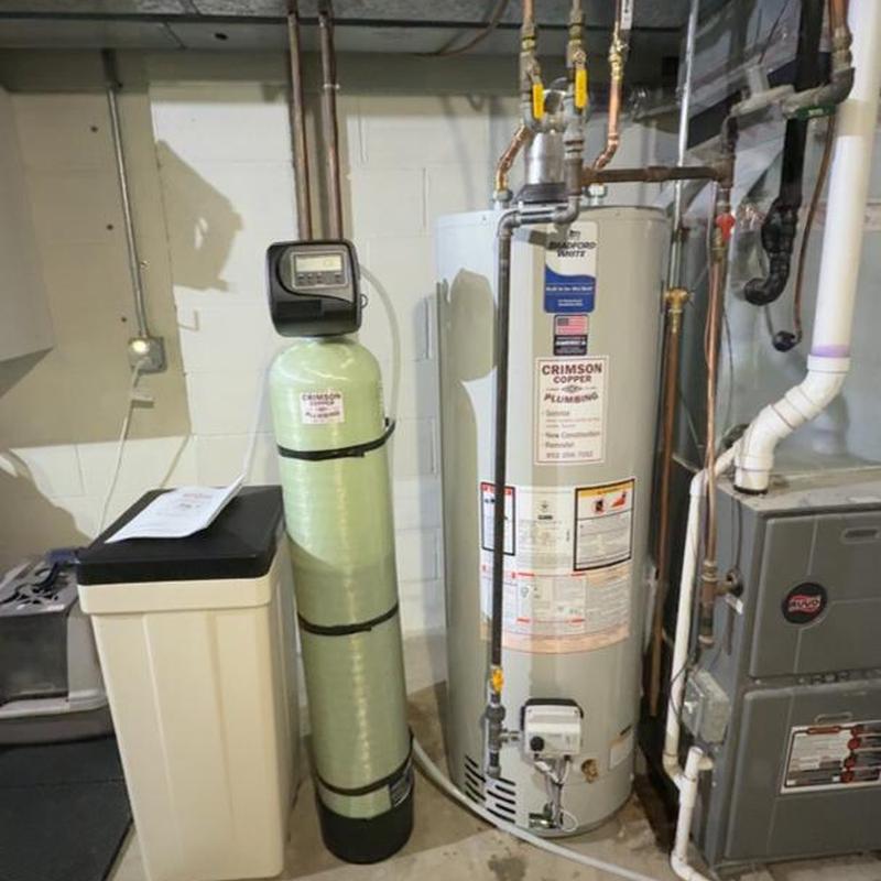 Bradford White water heater and Clack softener in basement