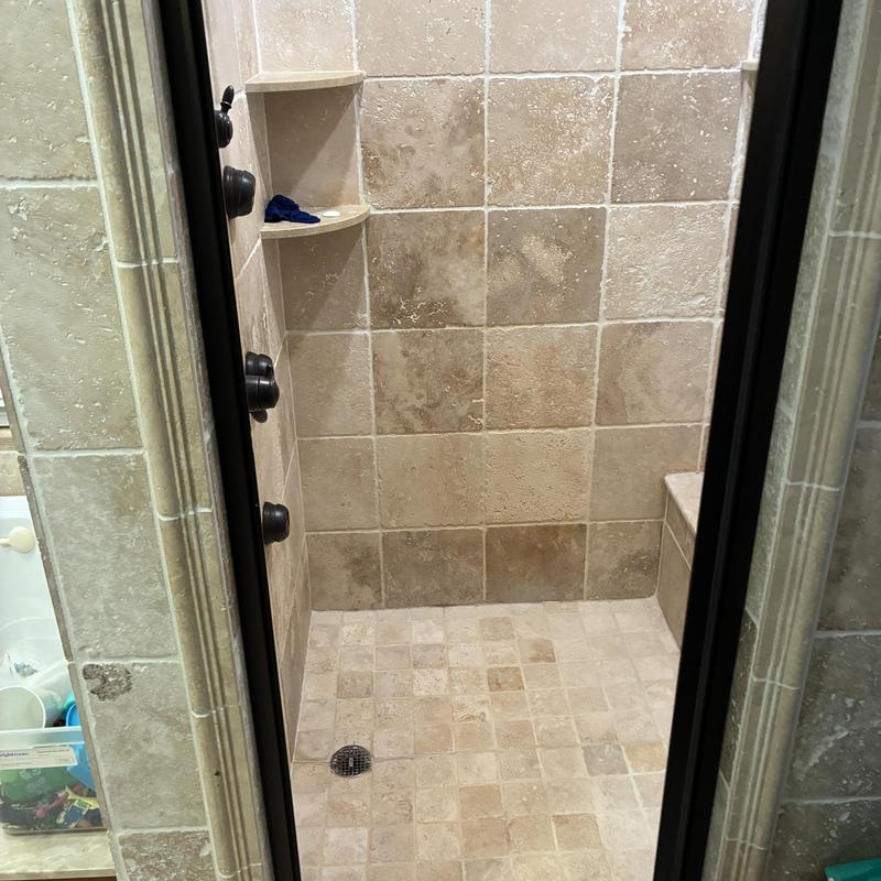 Shower stall tile and fixtures leak inspection indoors