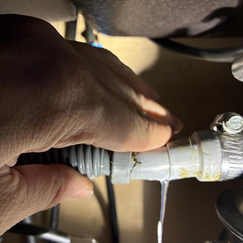 Dishwasher drain tubing installation under sink