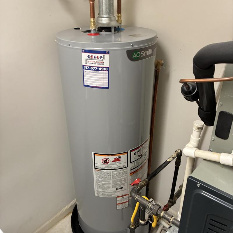 Gas water heater with copper and PVC piping installation