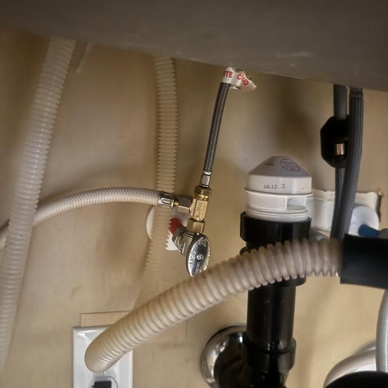 Angle stop and supply line under kitchen sink