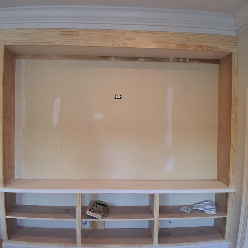 Built-in cabinet framing with crown molding installed Built-in cabinet framing with crown molding installed