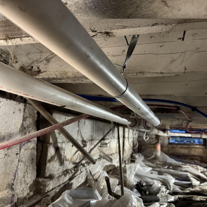 PVC drain pipes installed in crawl space