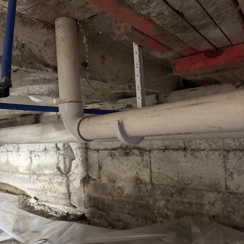 PVC drain pipes in crawl space installation