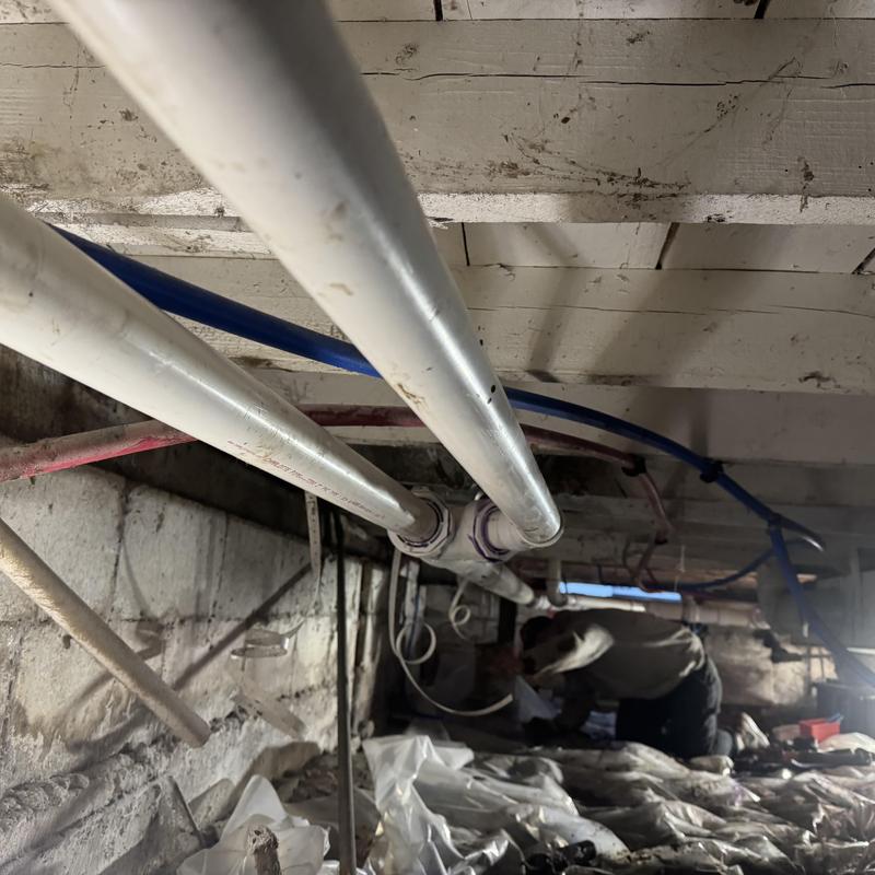PVC drain pipes in crawl space installation