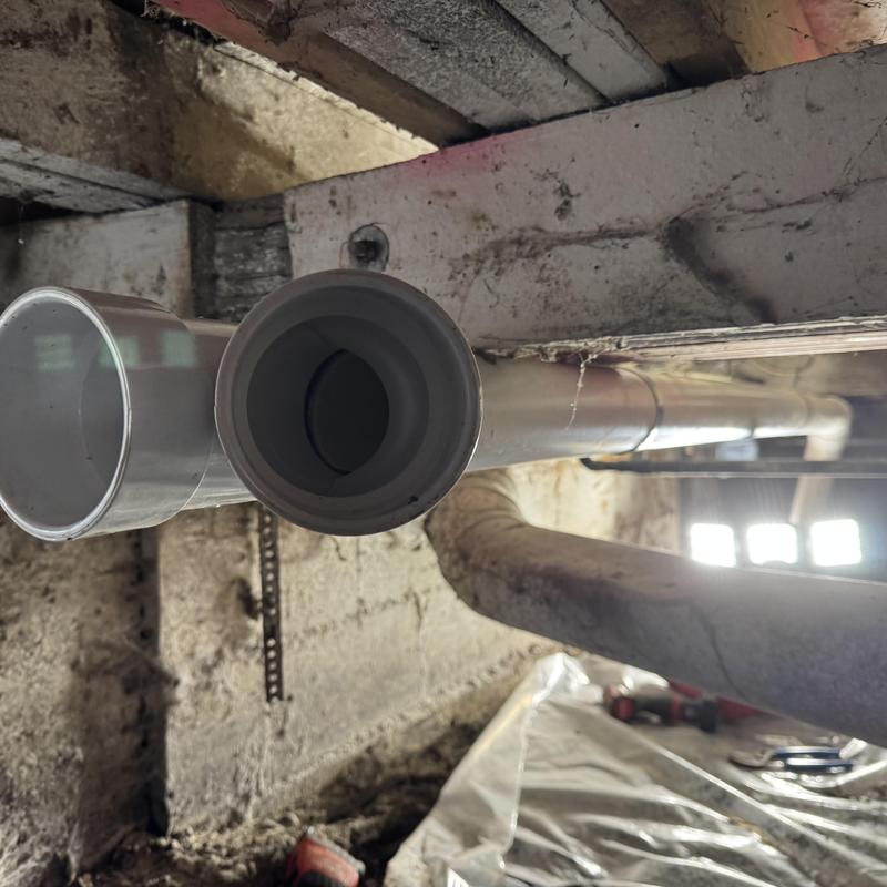 PVC drain pipes in crawl space installation