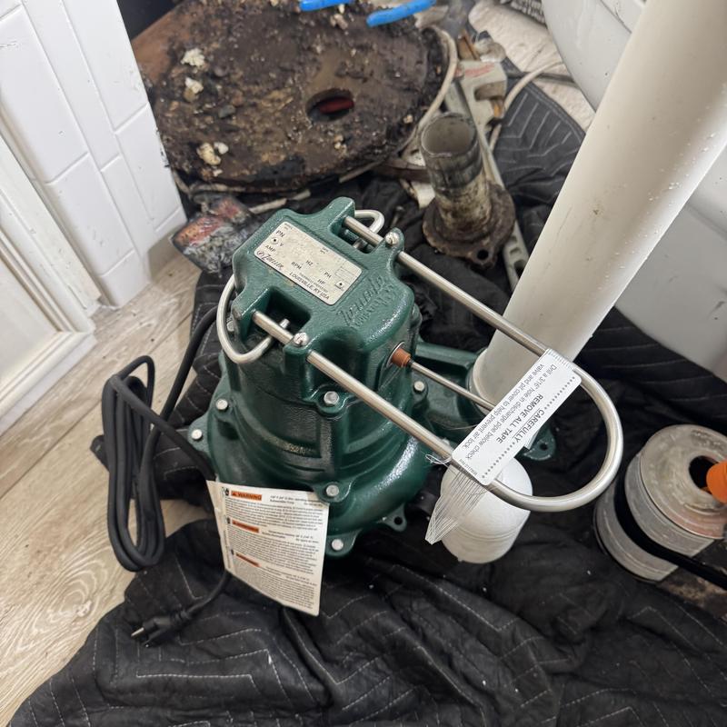 Zoeller M267 sewage pump installed near drain pipe