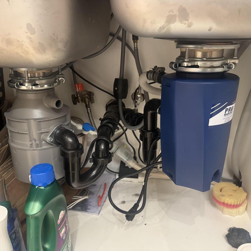 Disposal system under sink with new unit installed