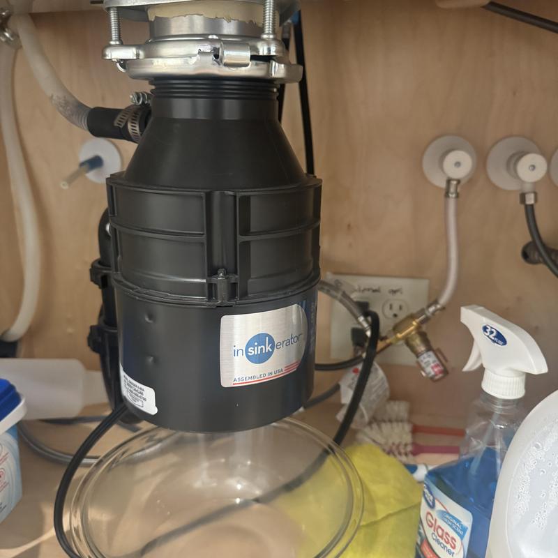 Garbage disposal system installation under sink