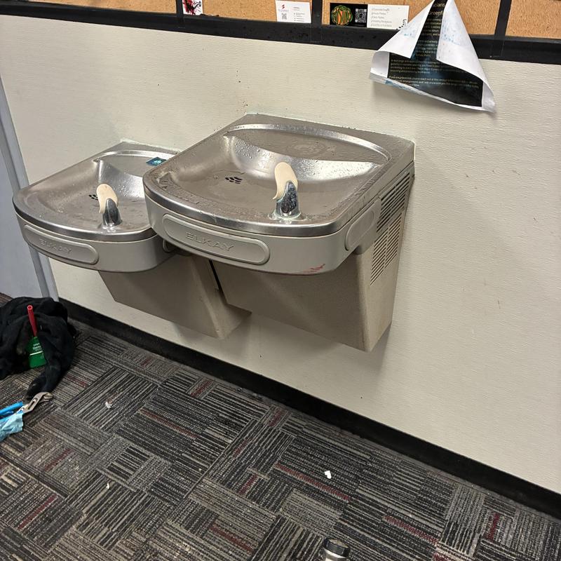Drinking fountain with cleared drain next to another unit