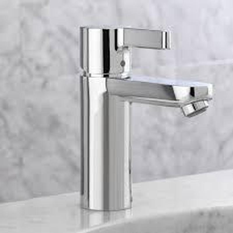 Wide spread chrome bathroom faucet on marble counter
