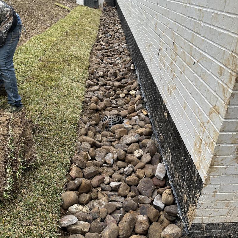 10-inch solid drain and perforated pipe with river rock backfill 10-inch solid drain and perforated pipe with river rock backfill