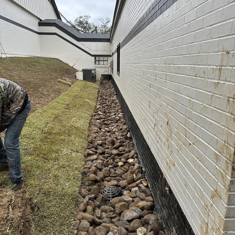 10-inch solid drain and river rock backfill next to house wall 10-inch solid drain and river rock backfill next to house wall