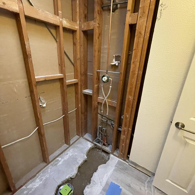 Shower drain trench and valve rough-in plumbing installation