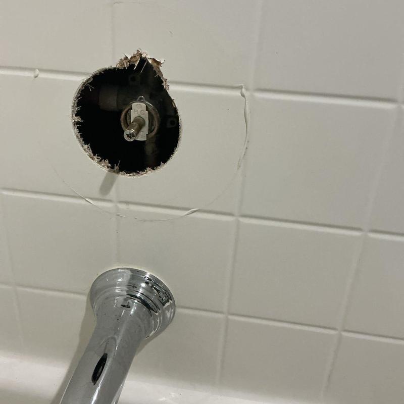 Moen Posi-Temp shower cartridge valve exposed in tile wall