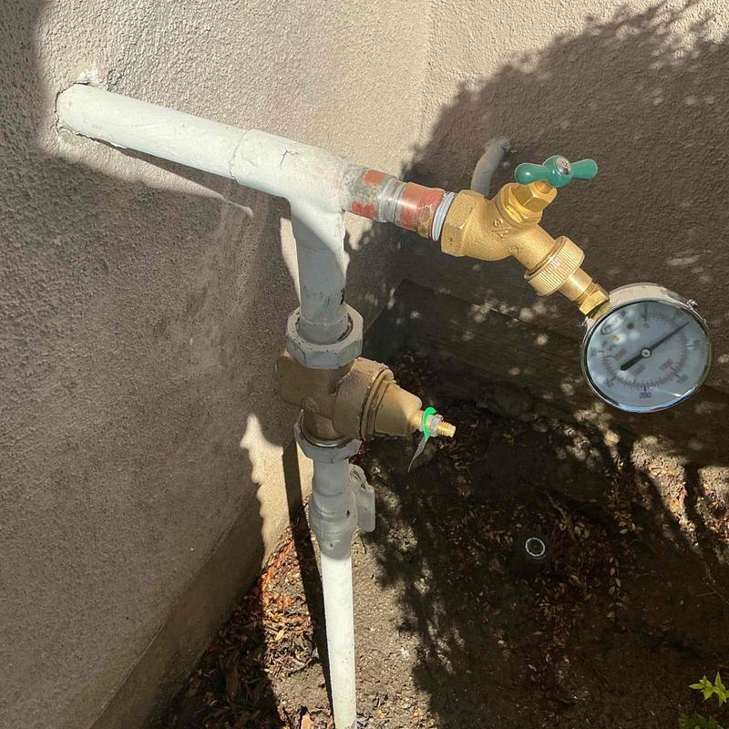 1-inch pressure regulator with pressure gauge installed outdoors