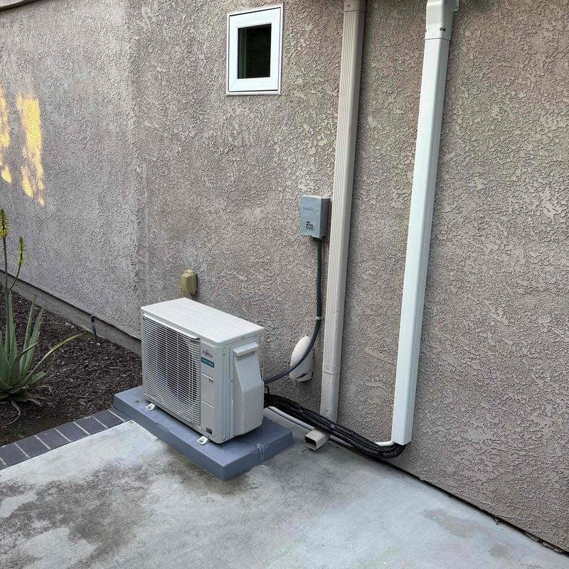 Fujitsu mini split outdoor unit on concrete pad