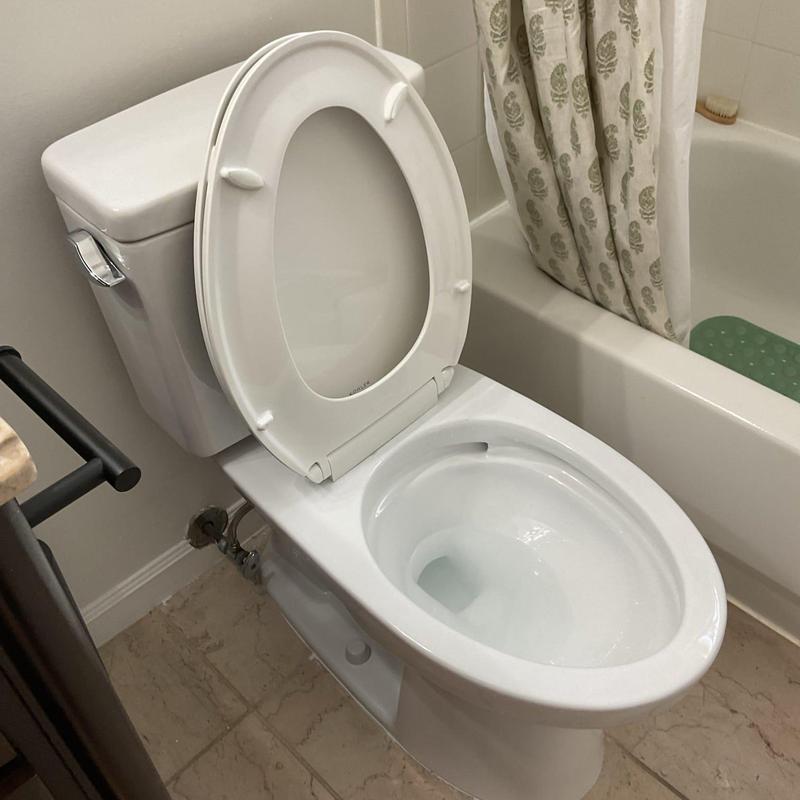 Toto Drake toilet with open lid in bathroom