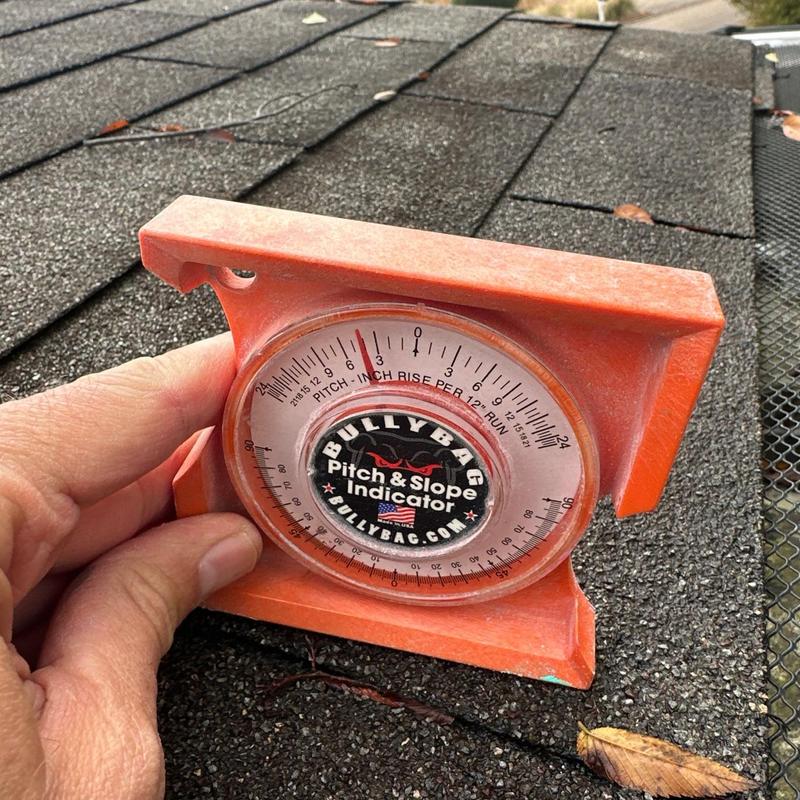 Roof pitch and slope indicator on asphalt shingles