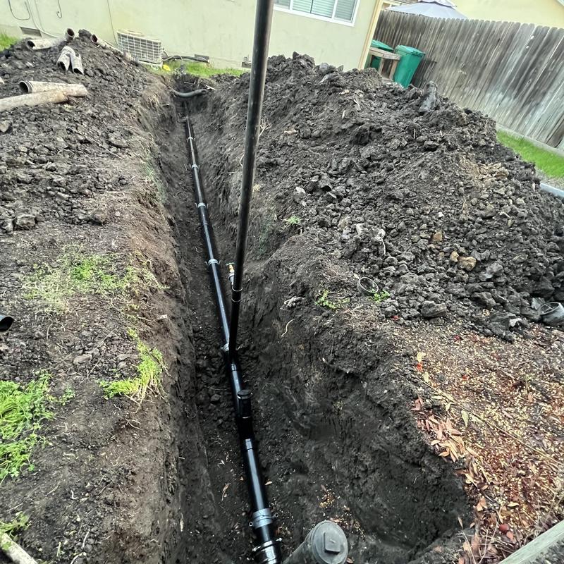 4-inch ABS sewer main pipe installation in trench
