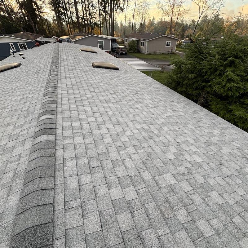 Asphalt shingle roof with ridge vent installation
