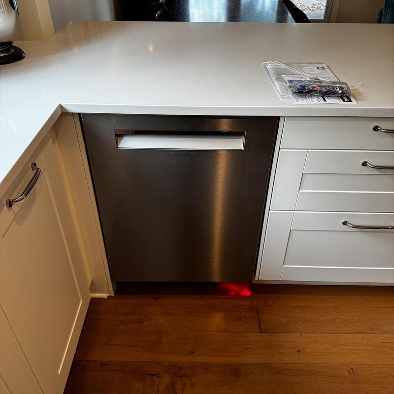 Dishwasher install in white kitchen cabinetry