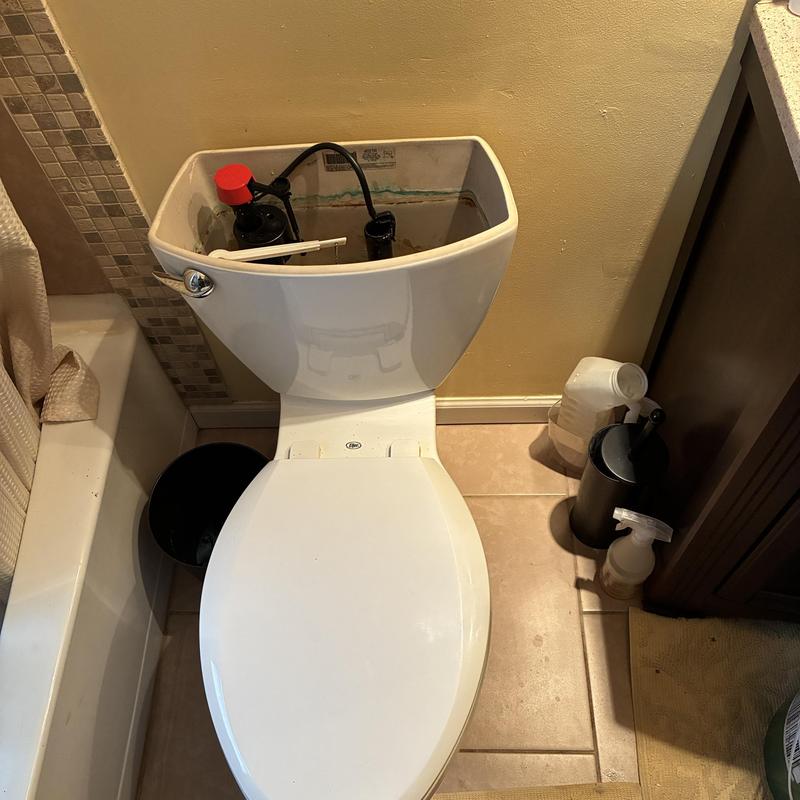 Toilet tank interior with rebuilt wear parts